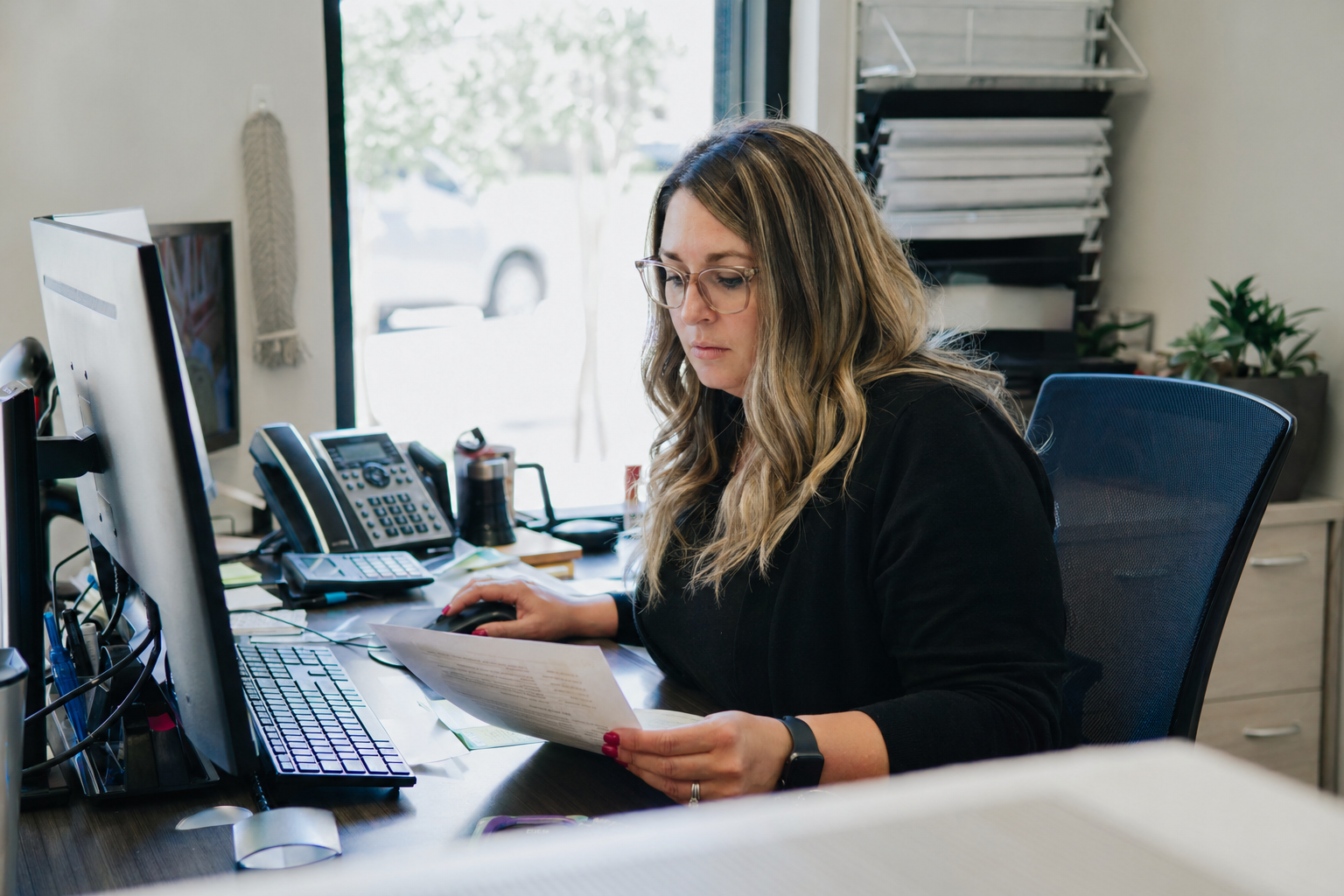 Staff member reviewing dormant customer list and outreach tasks